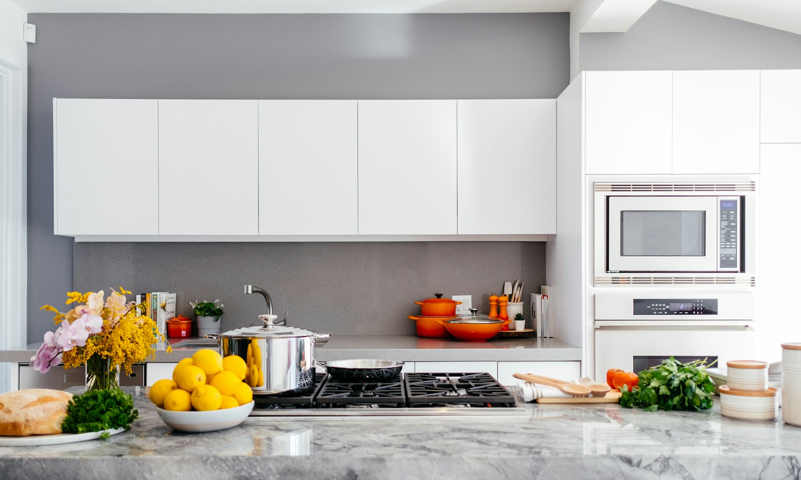 Cookware and fresh ingredients in a bright home kitchen
